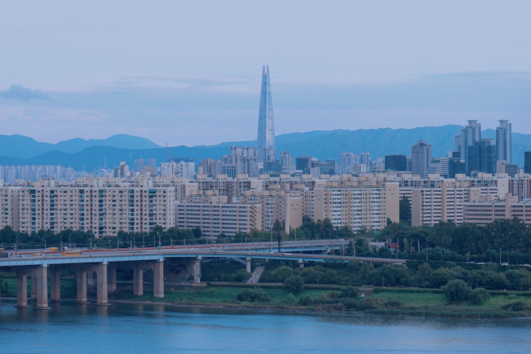 a large body of water with a city in the background