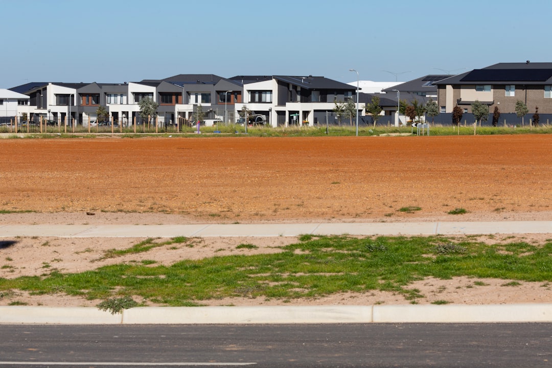 Modern houses under a clear blue sky.