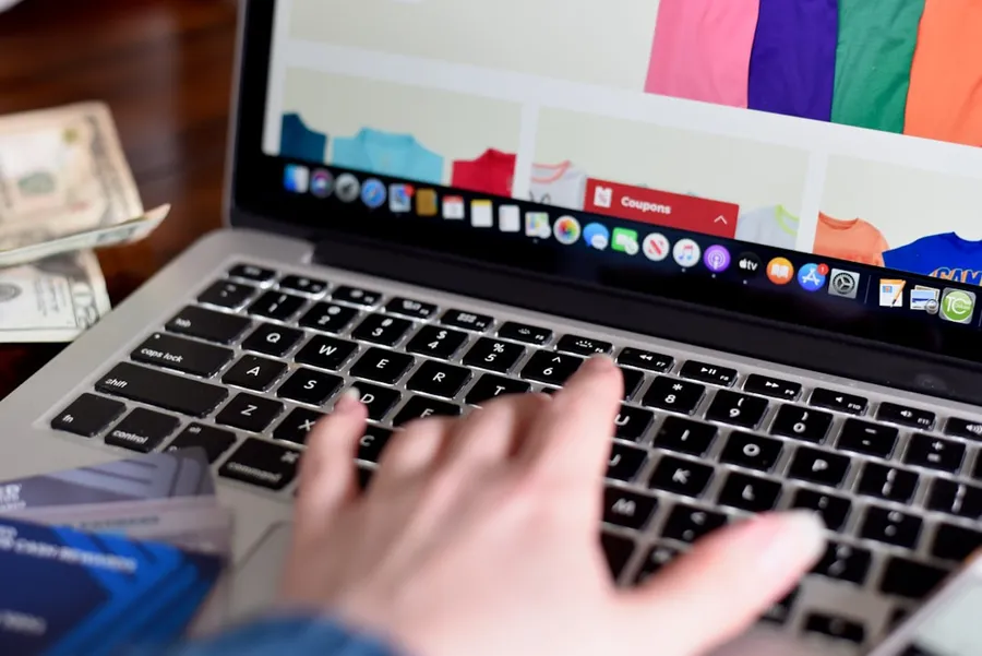 person using macbook pro turned on displaying game application