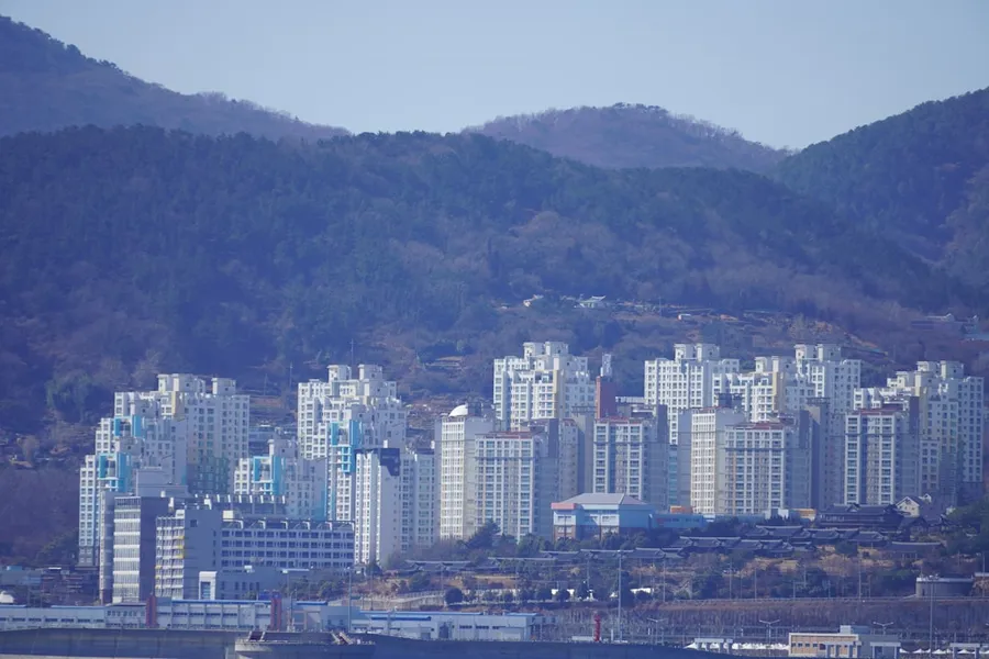 A large body of water with a city in the background